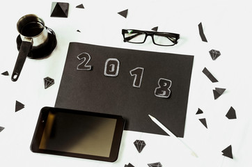 White background. black objects. workplace. plans for the new year in the records