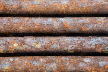 rusted discarded industrial pipes