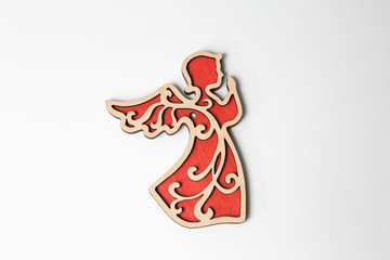 Red wooden christmas angel ornament on white