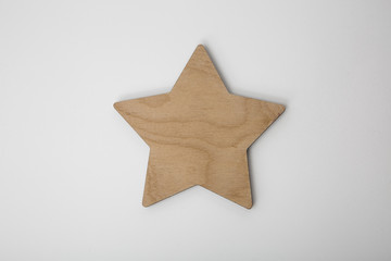 Wooden christmas star ornament on white