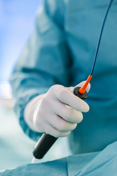 Surgeon Working with a Catheter in the Operating Room