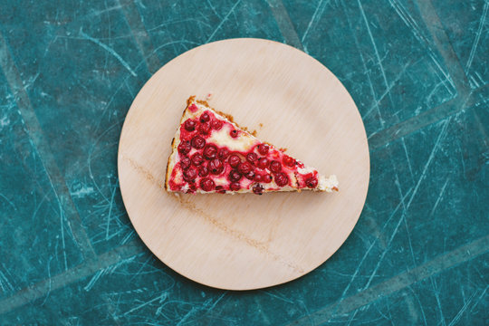 Currant cheesecake on a rustic green background