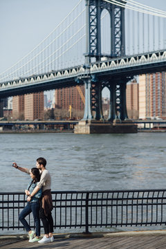 Young couple taking a selfie with smartphone