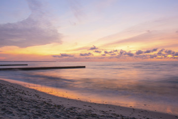 Fototapeta na wymiar Beautiful sunset over the sea on a long exposure