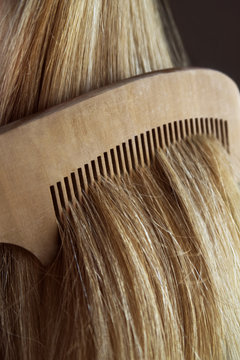 combing blond hair closeup