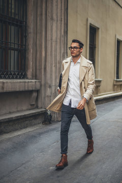 Young Business Man Walking in the Street.