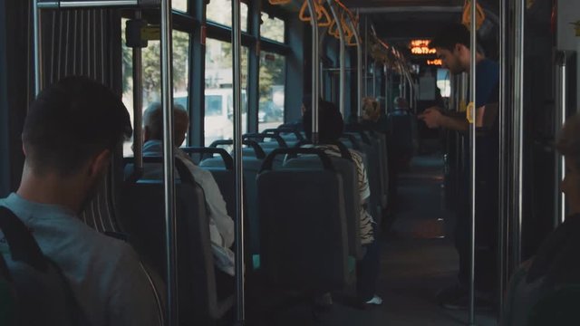 Perspective view on modern tram bus streetcar trolley from the passenger, public transport moving forward, city urban background. Shot on RED Epic Camera