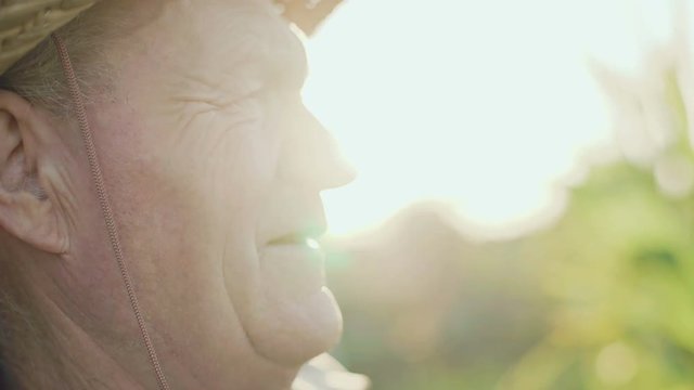 Beautiful portrait of profile of old sad man looking on the sky 4K