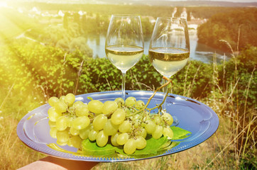Wine and grapes against vineyards in Rheinau, Switzerland