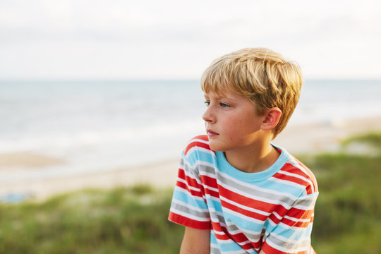 boy looking out at the ocean