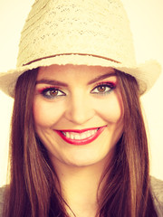 Happy flirty woman wearing sun hat