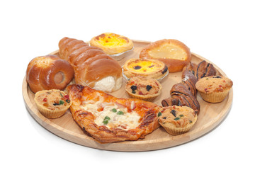 Obraz na płótnie Canvas variety of bakery on wooden plate
