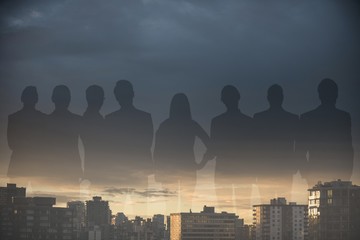 Composite image of business people standing over white