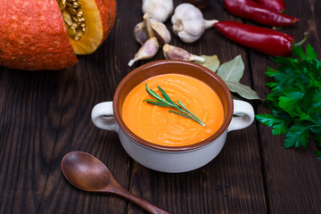 cream soup of fresh pumpkin in a ceramic plate