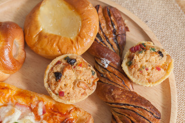 variety of bakery on wooden plate