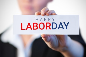 Composite image of close up of businesswoman holding blank card