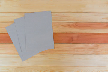 Top view of blank brown envelope on wood office table with copy space.