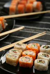 Japanese sushi on black plate
