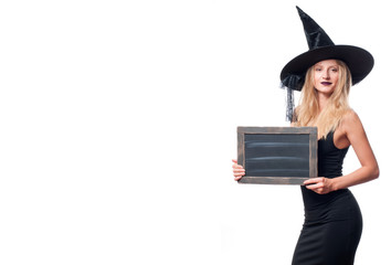 Happy woman in witch halloween costume with hat