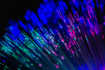 Fiber optics strands light on dark background