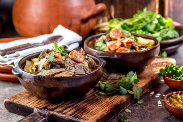 Chilean Ajiaco. Latin American food. Ajiaco - traditional chilean soup with grilled meat, onion and...