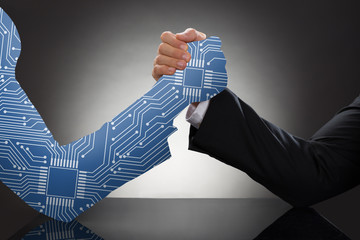 Two Businessman Arm Wrestling