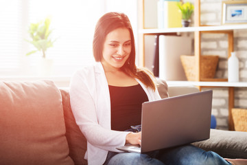 Smiling Woman Using Laptop