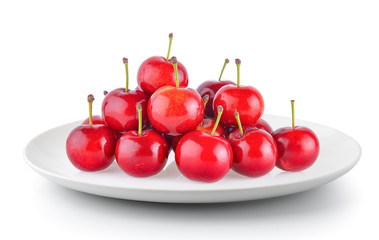 Cherry in a plate isolated on a white background