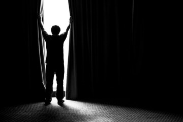 Obraz premium man and hope concept . man opening window curtains