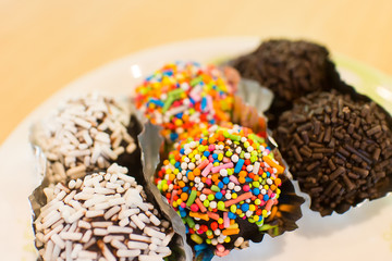 chocolate ball with topping in paper cup