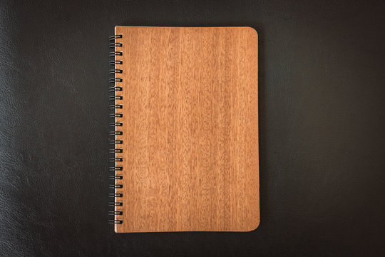 Close up notebook or notepad isolated on black background - Vintage filter