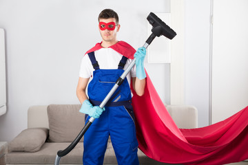 Janitor Cleaning Carpet With Vacuum Cleaner