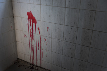 Blood on toilet tile metal wall