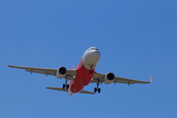 Passenger Airplane Taking Off Into The Blue Sky
