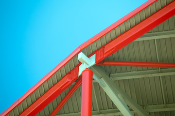 Fototapeta premium Roof steel construction of a stadium against blue sky
