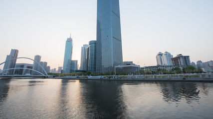 Naklejka premium Tianjin city waterfront downtown skyline over Haihe river,China.