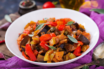 Hot spicy stew eggplant, sweet pepper, tomato and capers