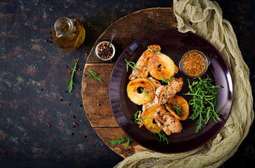 Chicken fillet with apples cooked on grill. Flat lay. Top view