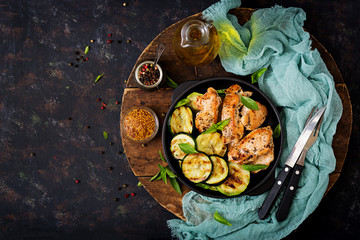 Chicken fillet with zucchini cooked on grill. Flat lay. Top view