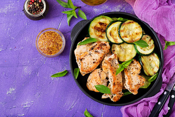 Chicken fillet with zucchini cooked on grill. Flat lay. Top view