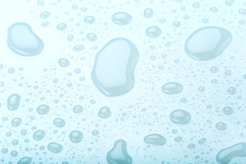 water drop on surface of fresh blue background