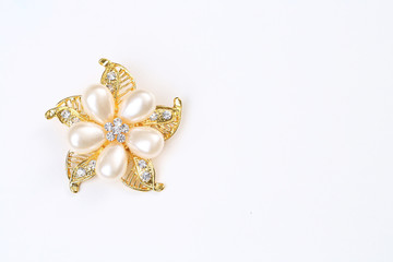 diamond and pearl on golden flower with brooch