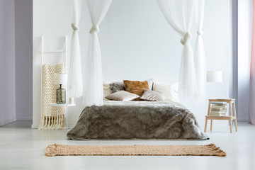 King-size bed with fur coverlet