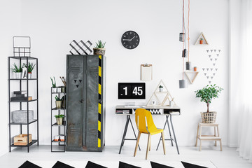 Bright workspace with yellow chair
