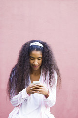 afro girl using her mobile phone