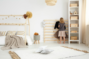Girl in scandinavian style bedroom