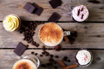 Coffee in glass on the wooden background