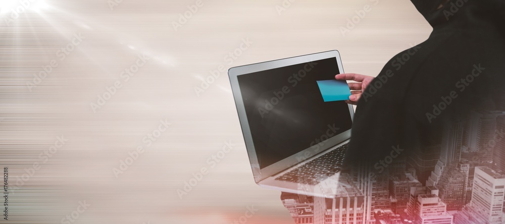 Poster composite image of rear view of hacker using laptop and credit