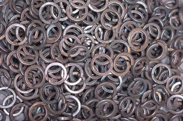 Lock washers are treated with an anti-corrosion compound, in a chaotic order in the box