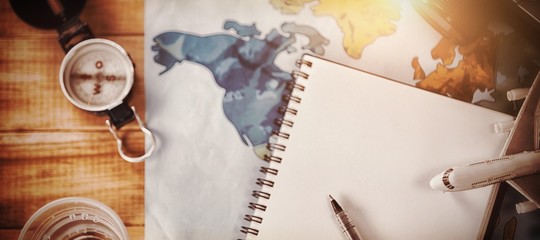Overhead view of diary with map and camera © vectorfusionart
